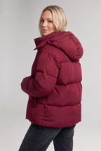 Women's Oversized Padded Puffer Jacket with Detachable Hood and Pockets in Burgundy – Side View