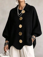 Women's oversized rib knit cardigan with large gold buttons and a scalloped hem