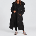 Women's long hooded puffer coat with a tie belt at the waist