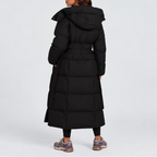 Women's long hooded puffer coat with a tie belt at the waist