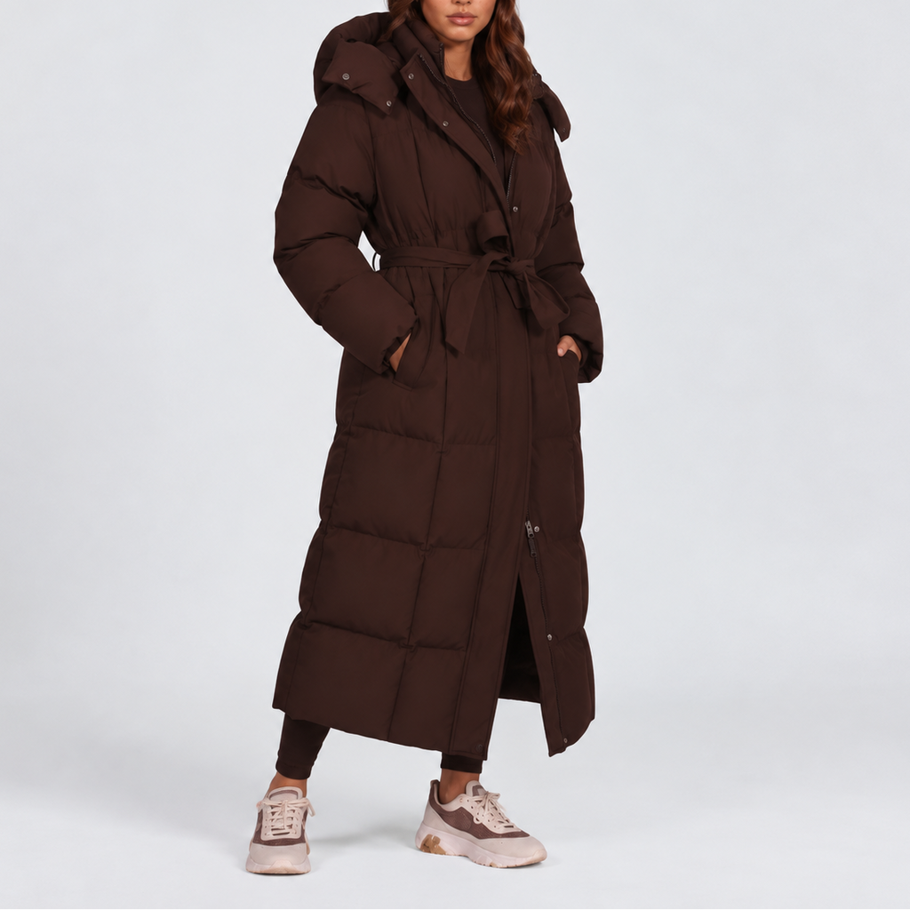Women's long hooded puffer coat with a tie belt at the waist