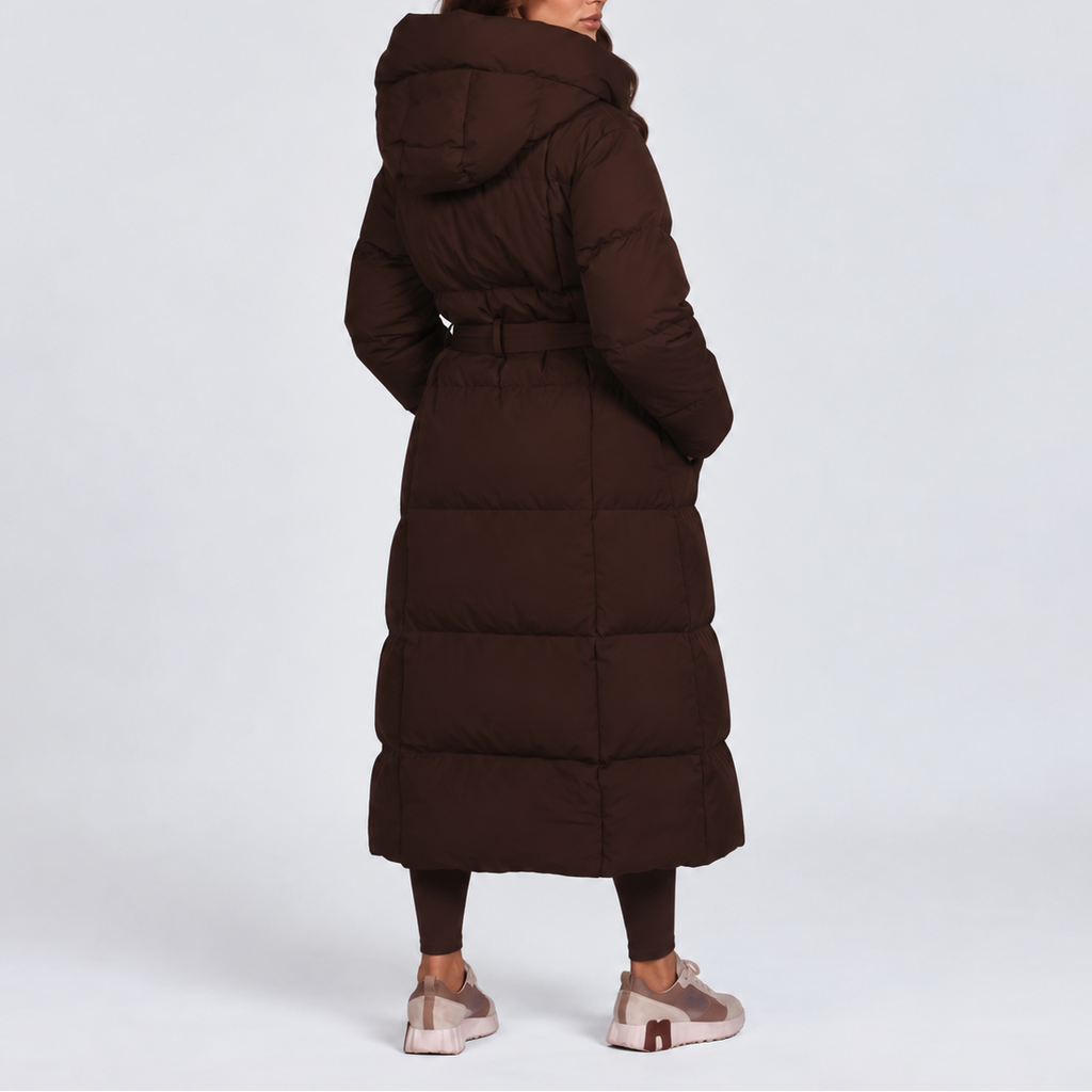 Women's long hooded puffer coat with a tie belt at the waist