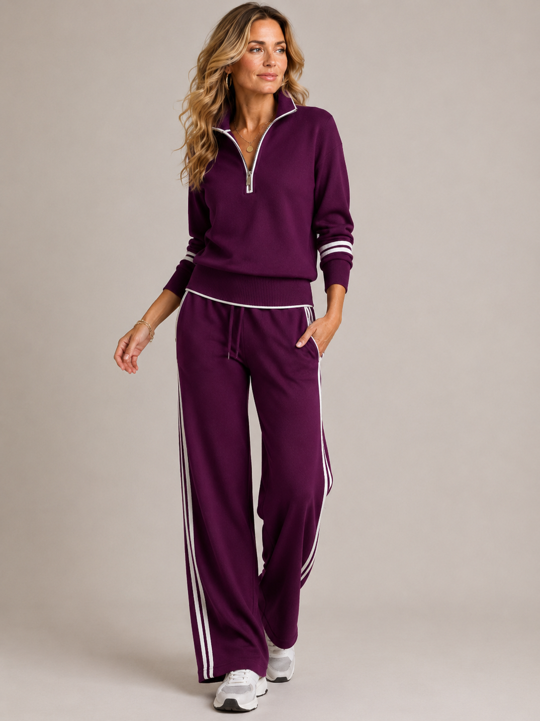 Women's knitted two piece set with a quarter zip jumper and wide leg trousers