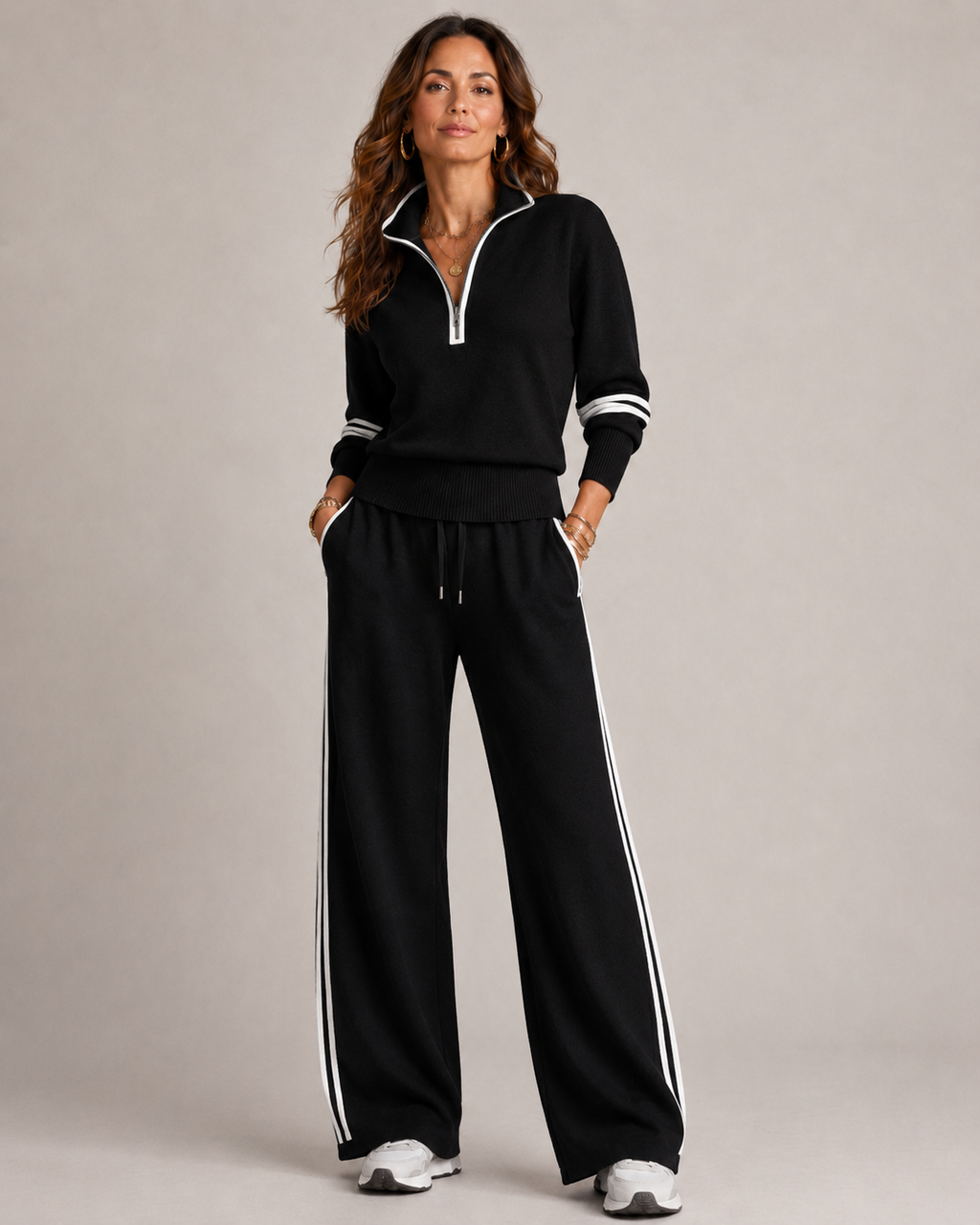 Women's knitted two piece set with a quarter zip jumper and wide leg trousers