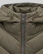 Women's hooded quilted puffer jacket with zip front and chevron padding