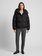 Women's oversized puffer jacket with a hood and a drawcord hem