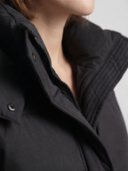Women's oversized puffer jacket with a hood and a drawcord hem