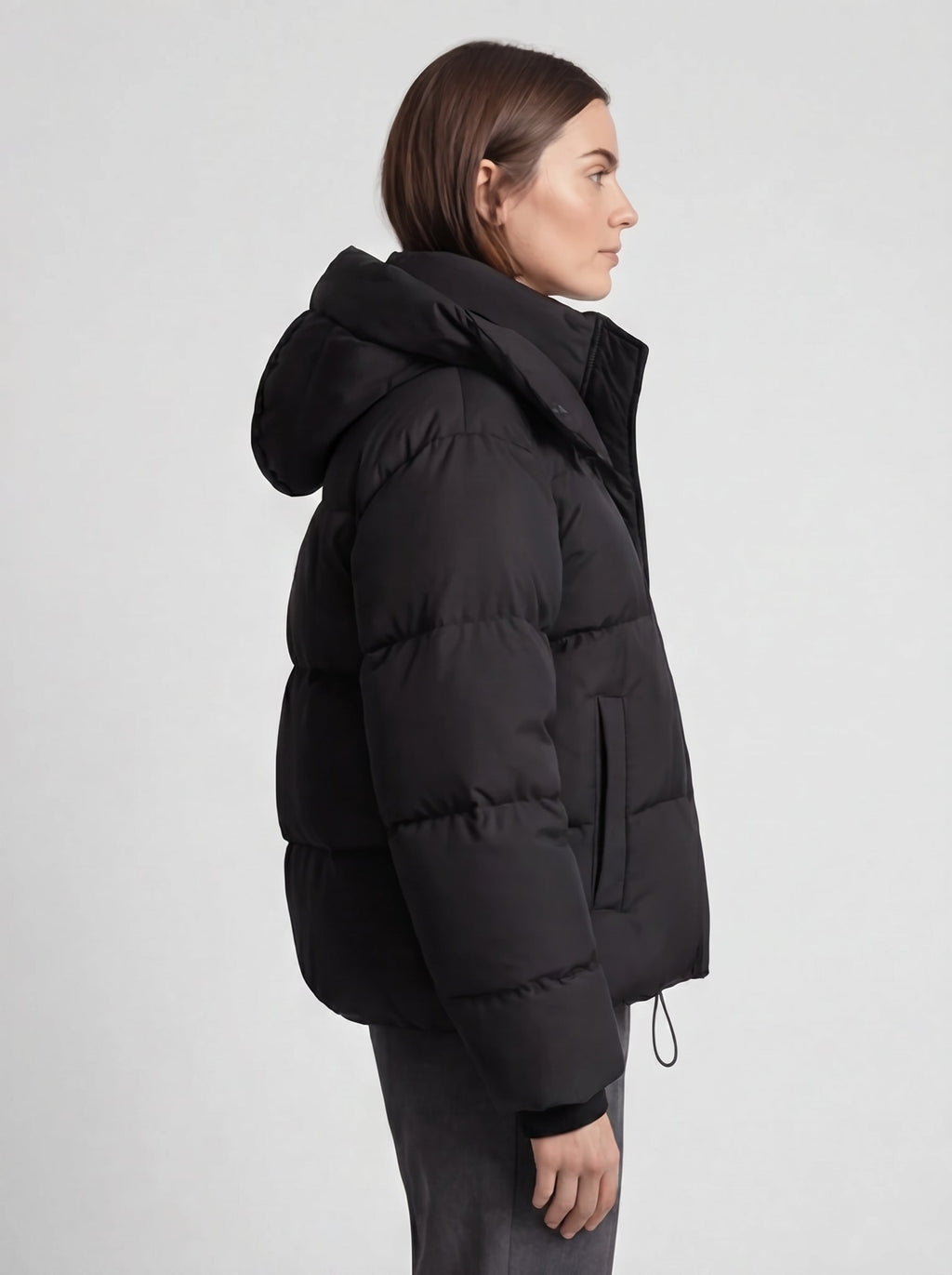 Women's oversized puffer jacket with a hood and a drawcord hem