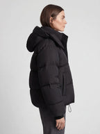 Women's oversized puffer jacket with a hood and a drawcord hem