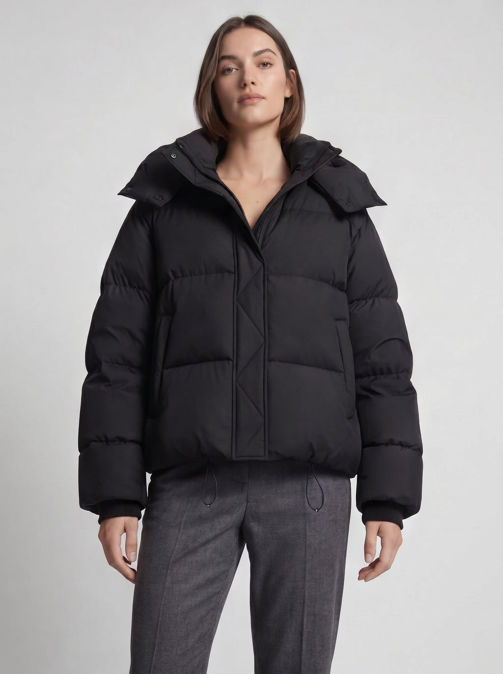 Women's oversized puffer jacket with a hood and a drawcord hem