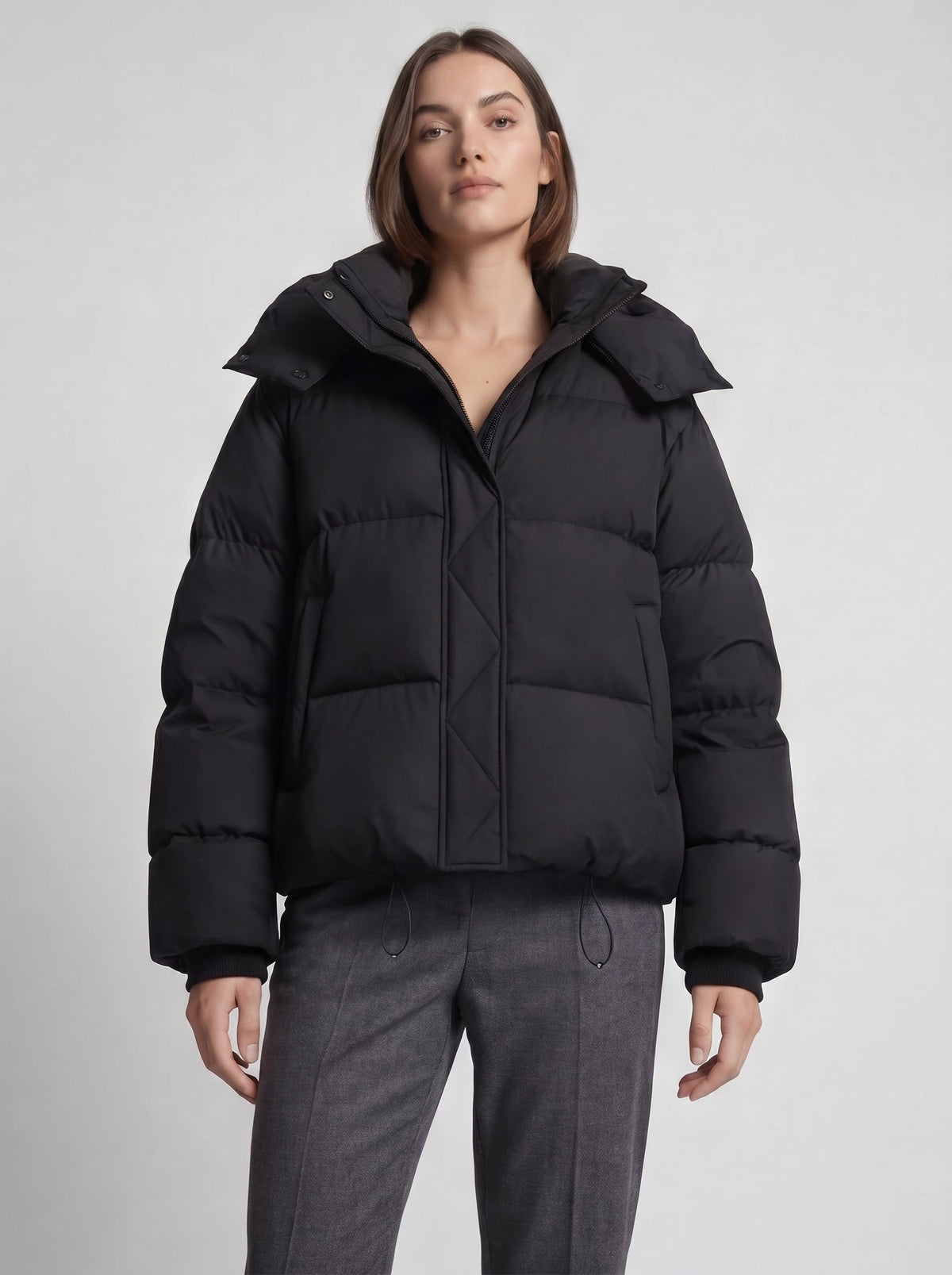 Women's oversized puffer jacket with a hood and a drawcord hem