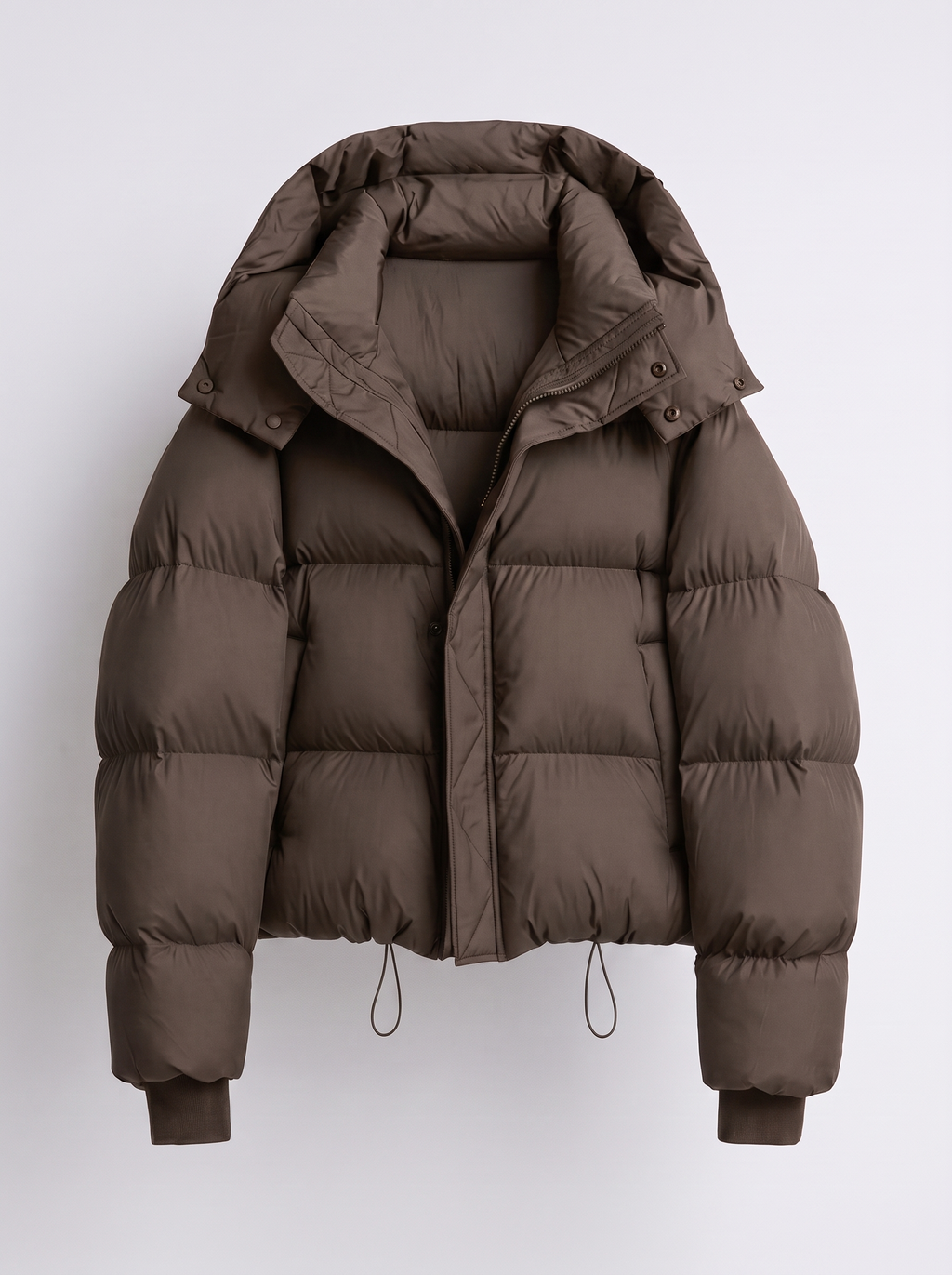 Women's oversized puffer jacket with a hood and a drawcord hem