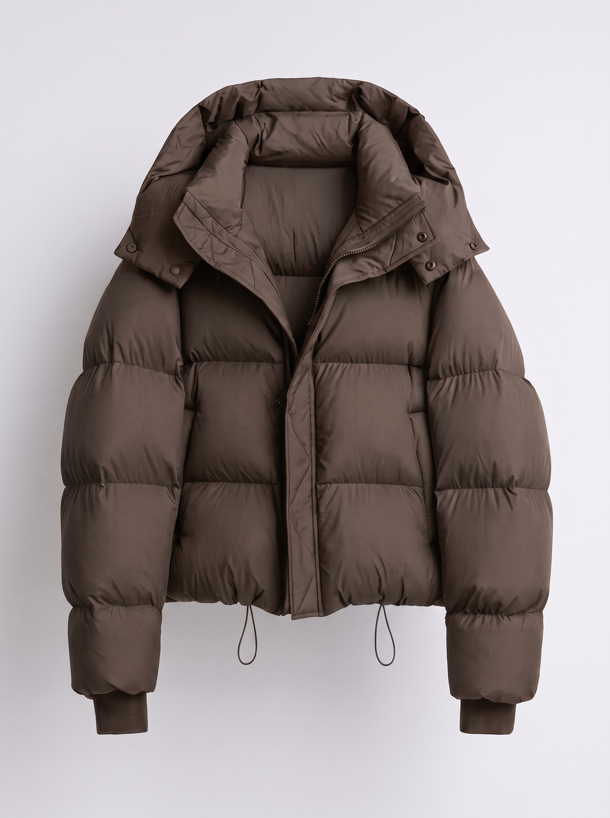 Women's oversized puffer jacket with a hood and a drawcord hem