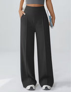 Women's wide leg trousers with a wide elasticated high waistband and side pockets