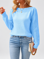 Blue knitted jumper three-quarter studio view