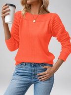 orange knitted jumper studio view
