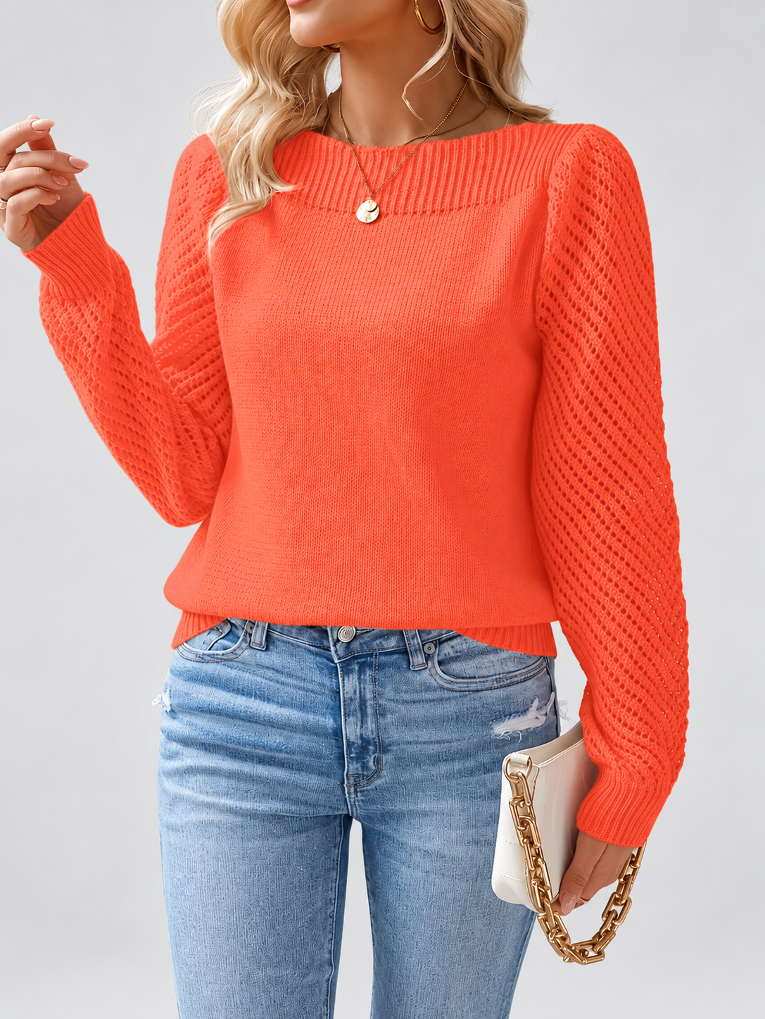 orange knitted jumper three-quarter studio view