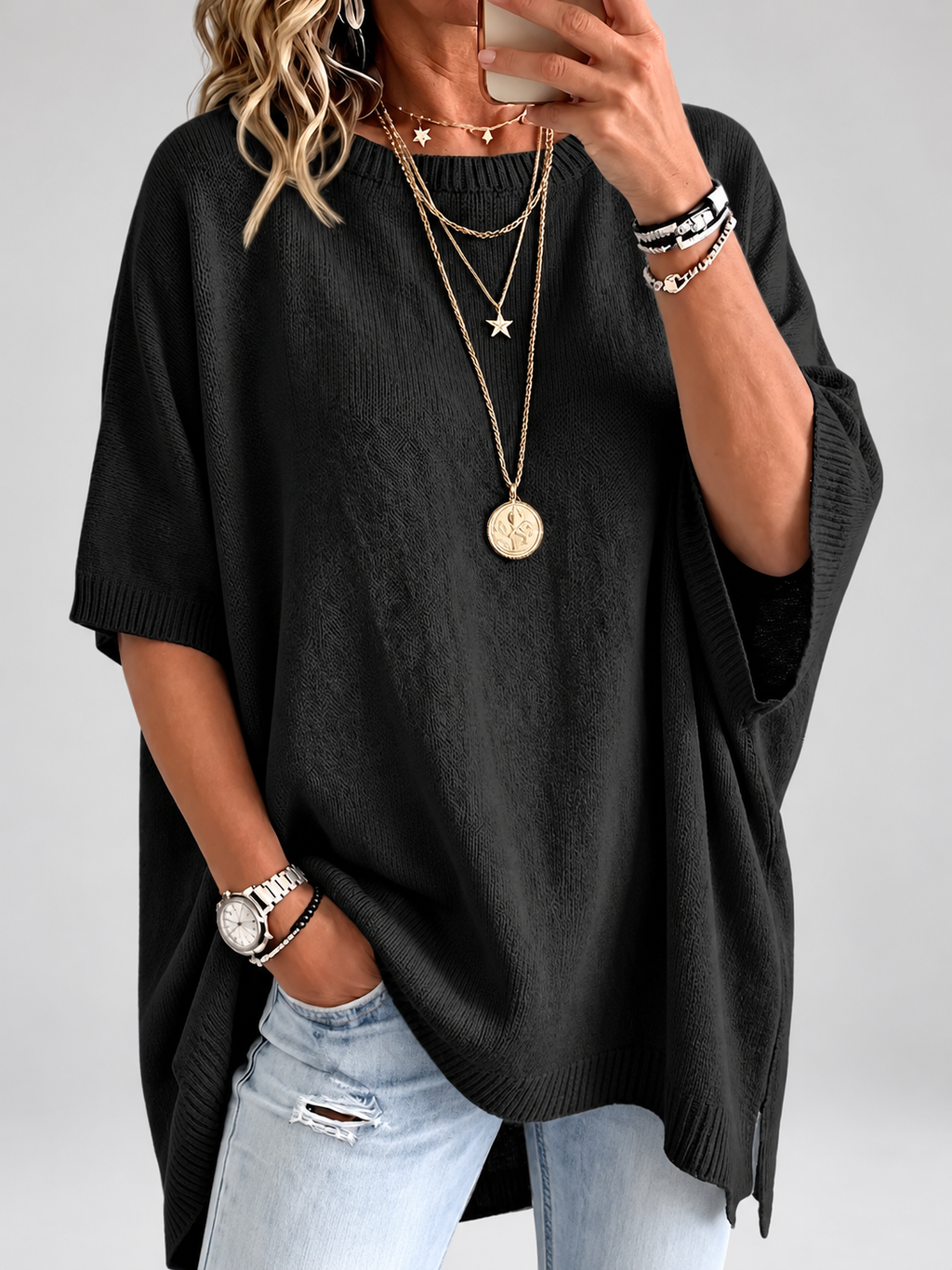 Women's oversized knitted jumper in black – studio view 1