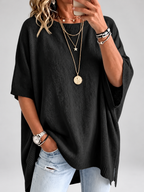 Women's oversized knitted jumper in black – studio view 1