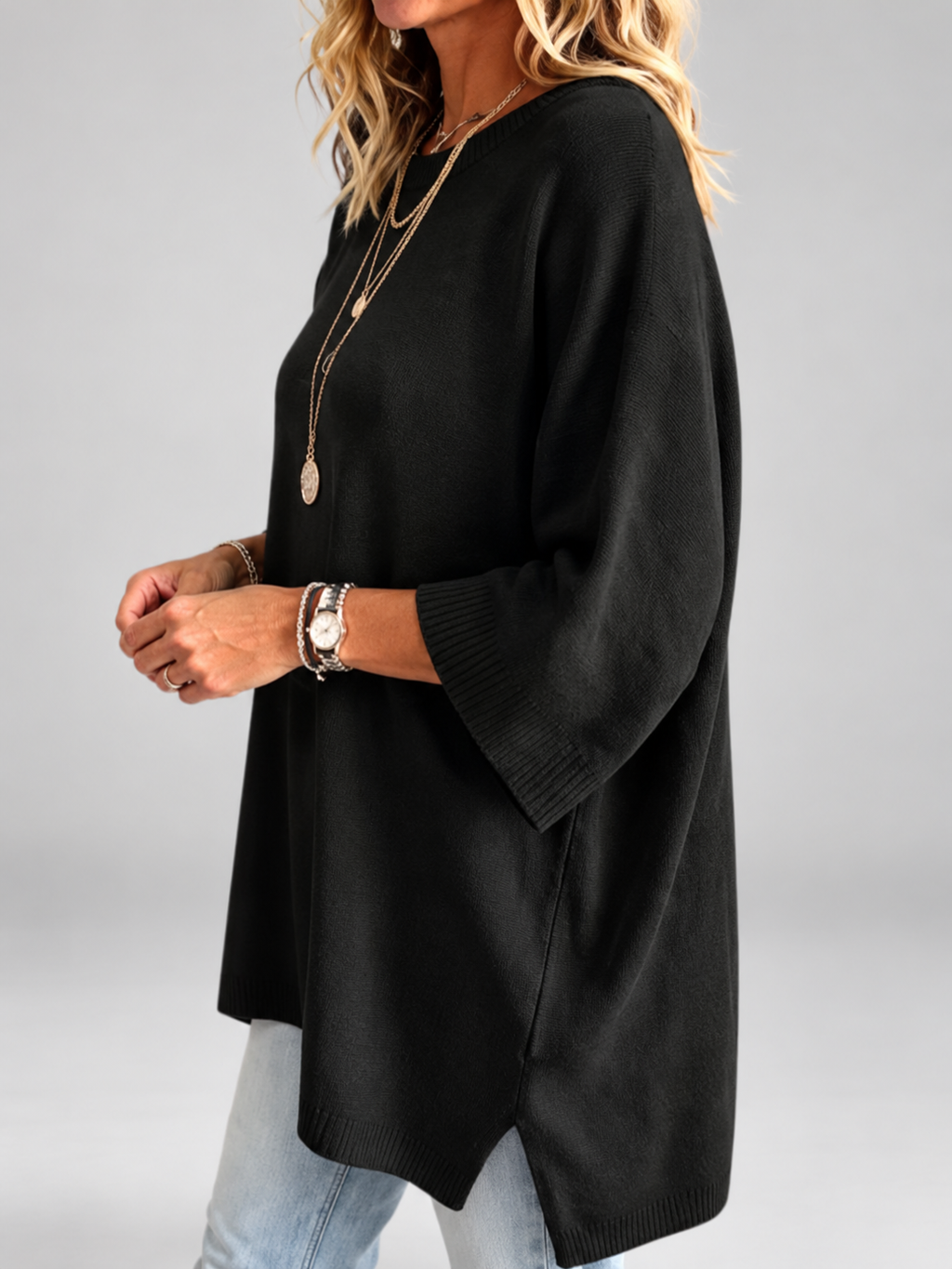 Women's oversized knitted jumper in black – studio view 2