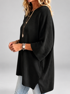 Women's oversized knitted jumper in black – studio view 2