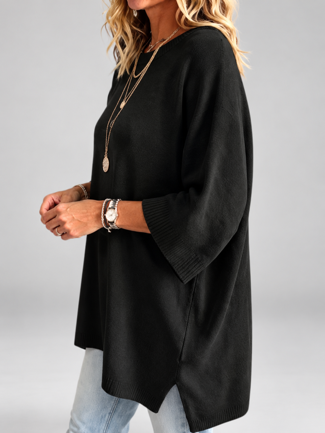 Women's oversized knitted jumper in black – studio view 2