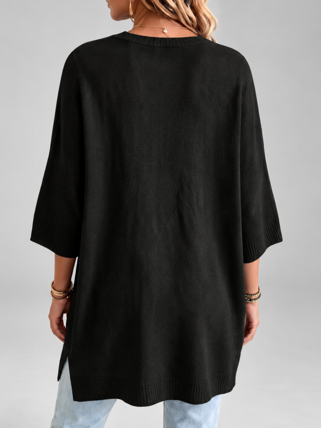 Women's oversized knitted jumper in black – studio view 4