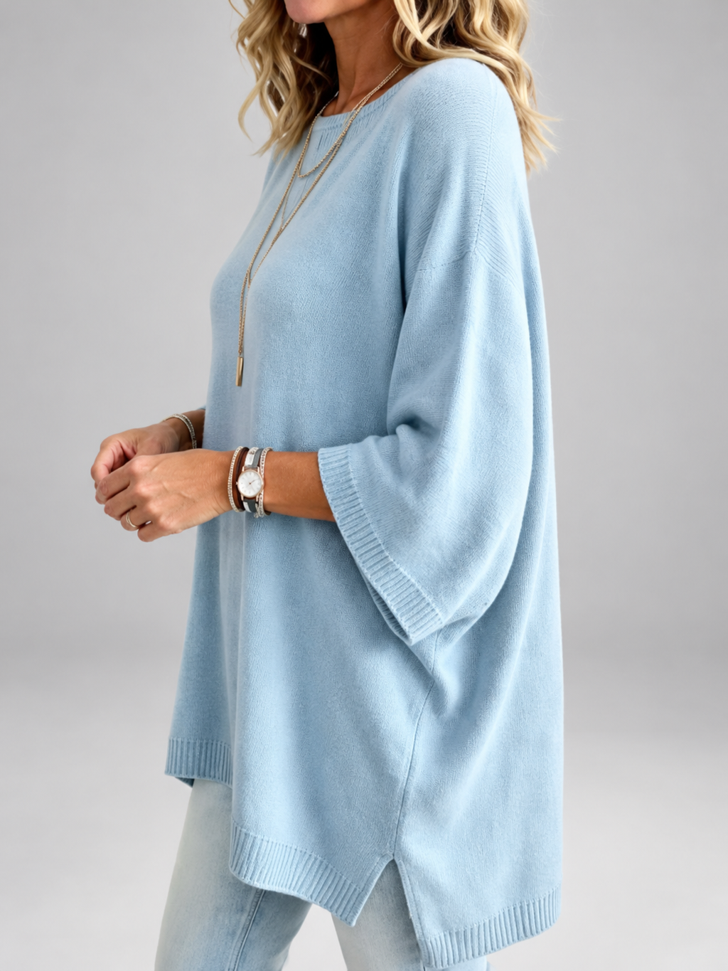 Women's oversized knitted jumper in Light Blue – studio view 1