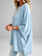 Women's oversized knitted jumper in Light Blue – studio view 1