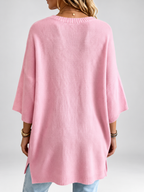 Women's oversized knitted jumper in Pink – studio view 3