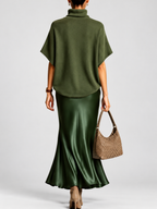 Green roll neck poncho top and flared skirt, studio view 9