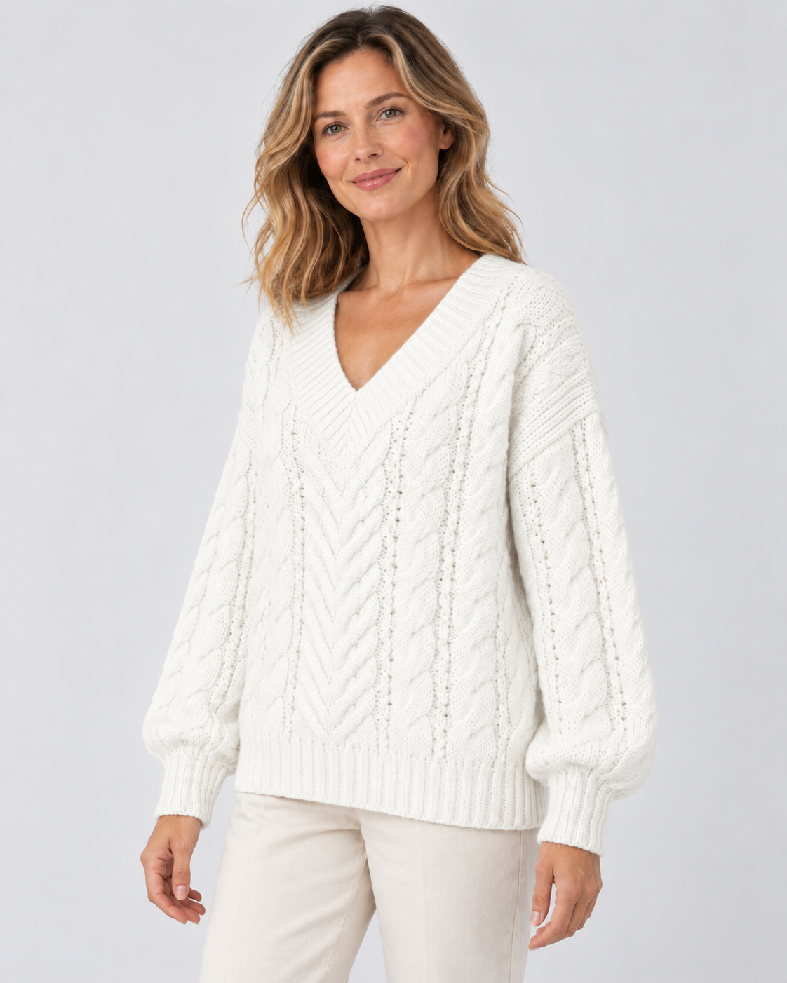 white cable knit V-neck jumper – 02_three-quarter studio view