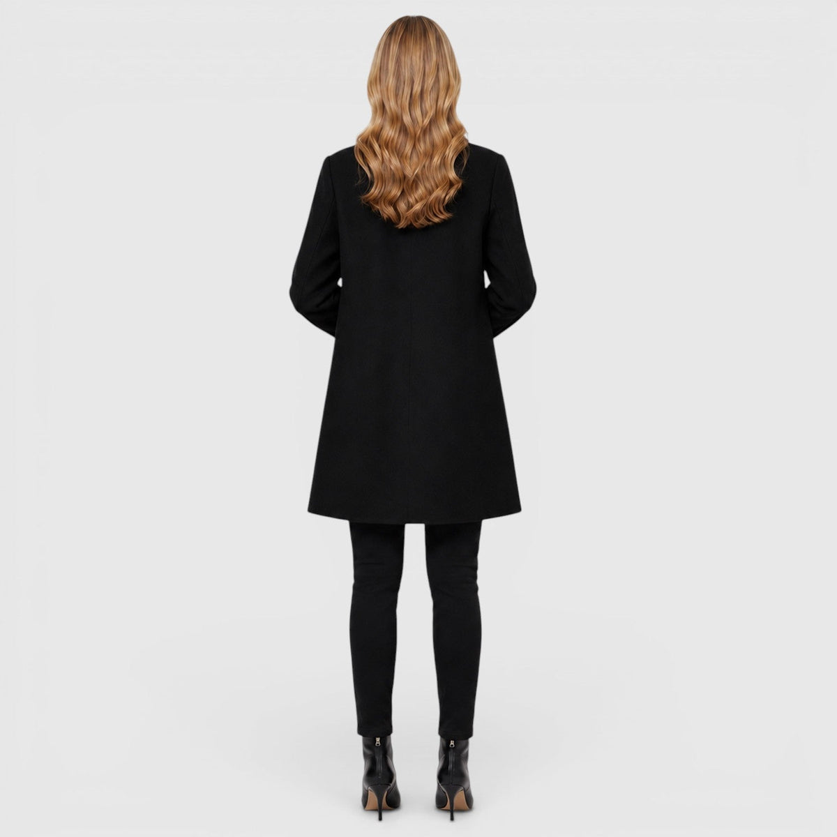 Women's wool blend longline coat with a button front and side pockets