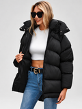 Women's Oversized Hooded Puffer Jacket with Funnel Neck and Dipped Hem in Black – Front View