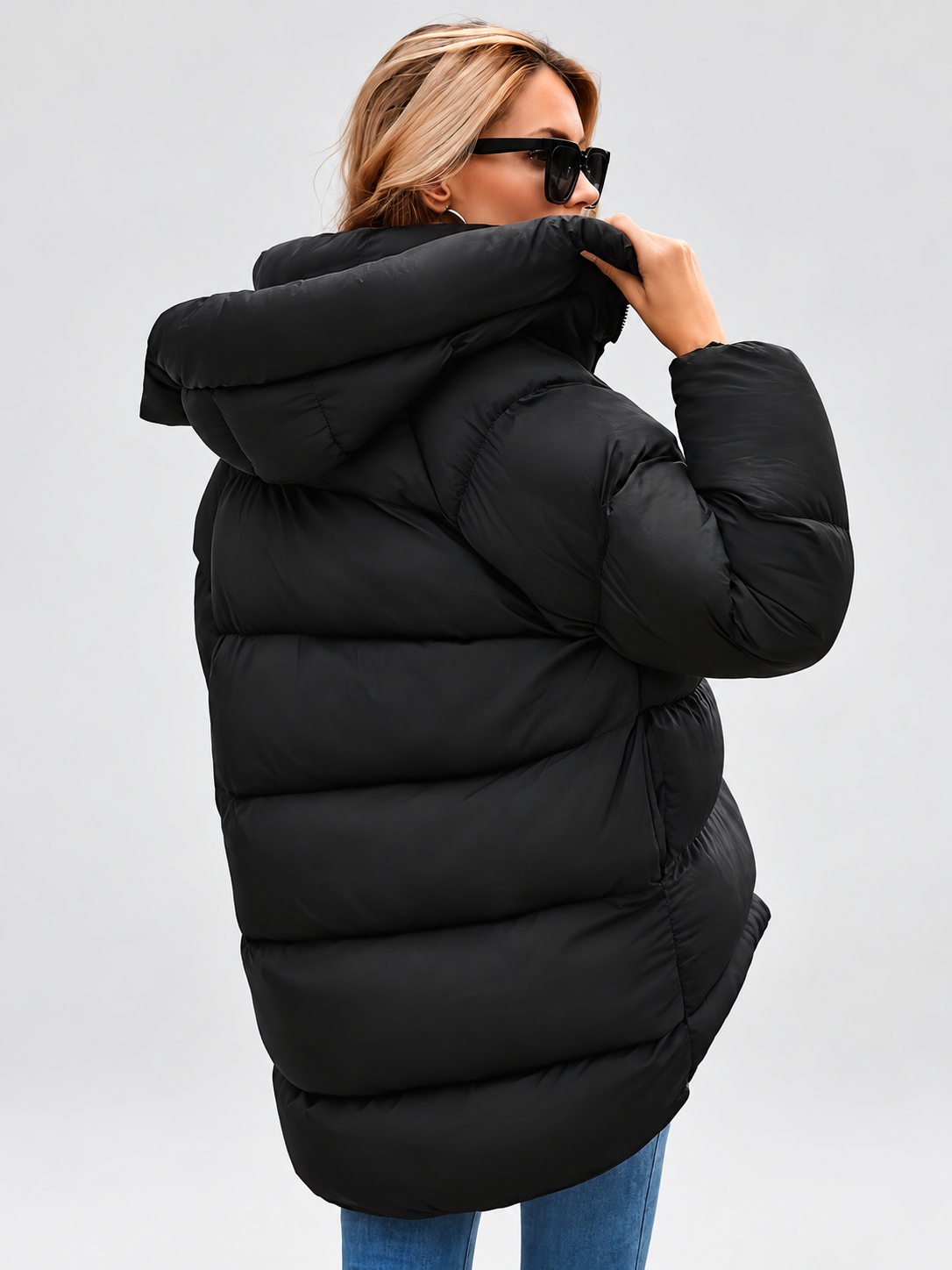 Women's Oversized Hooded Puffer Jacket with Funnel Neck and Dipped Hem in Black – Back View