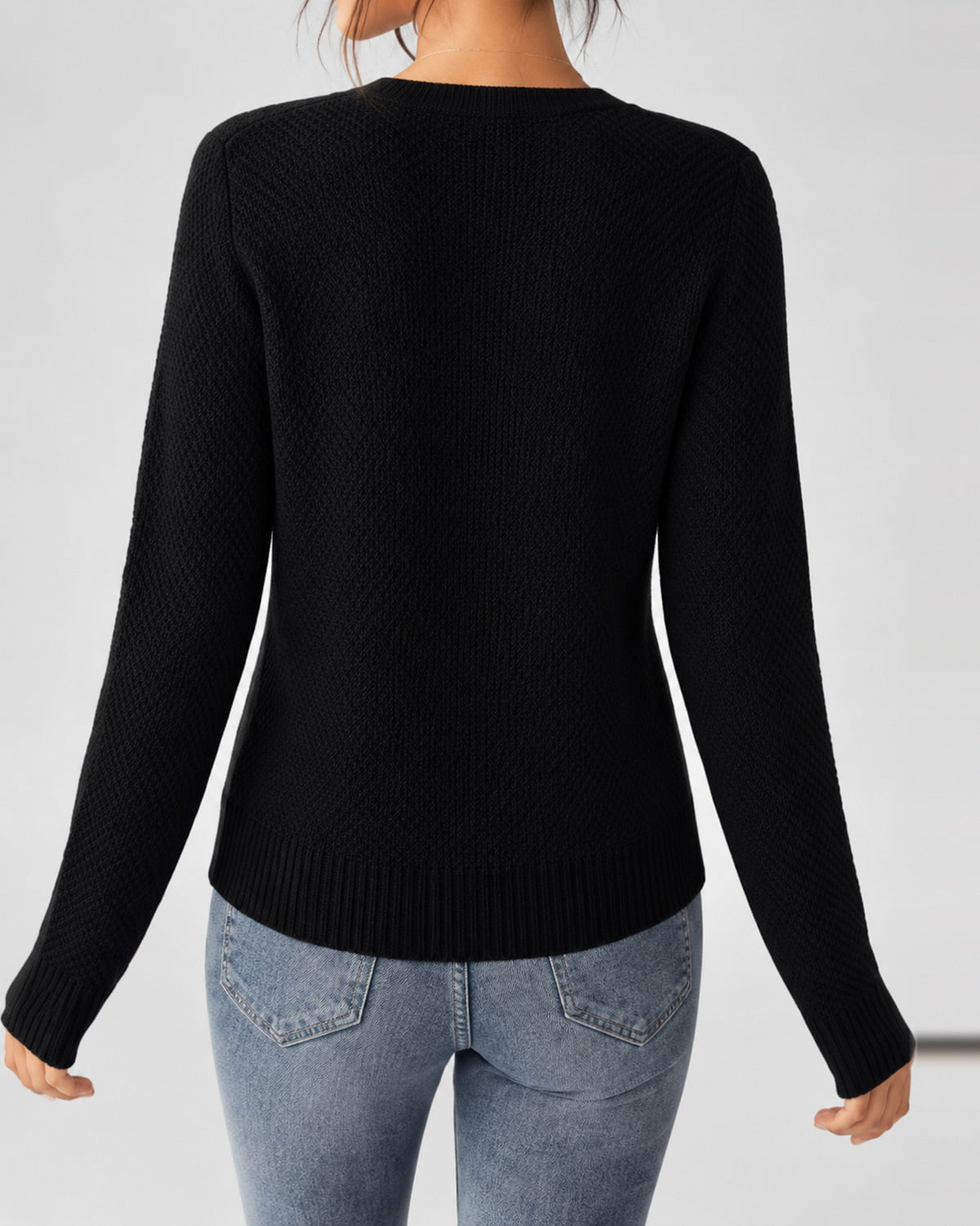 Women's Cable Knit Cardigan with Round Neck and Button Front in Black – back view