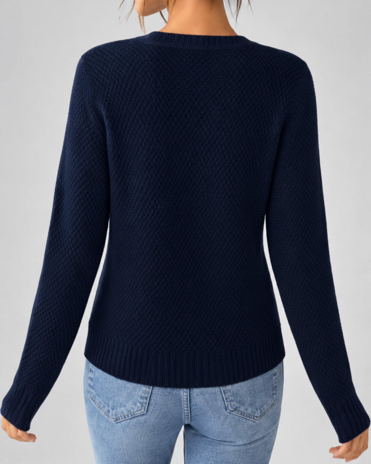 Women's Cable Knit Cardigan with Round Neck and Button Front in Navy – back view