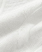Women's Cable Knit Cardigan with Round Neck and Button Front in White – knit detail