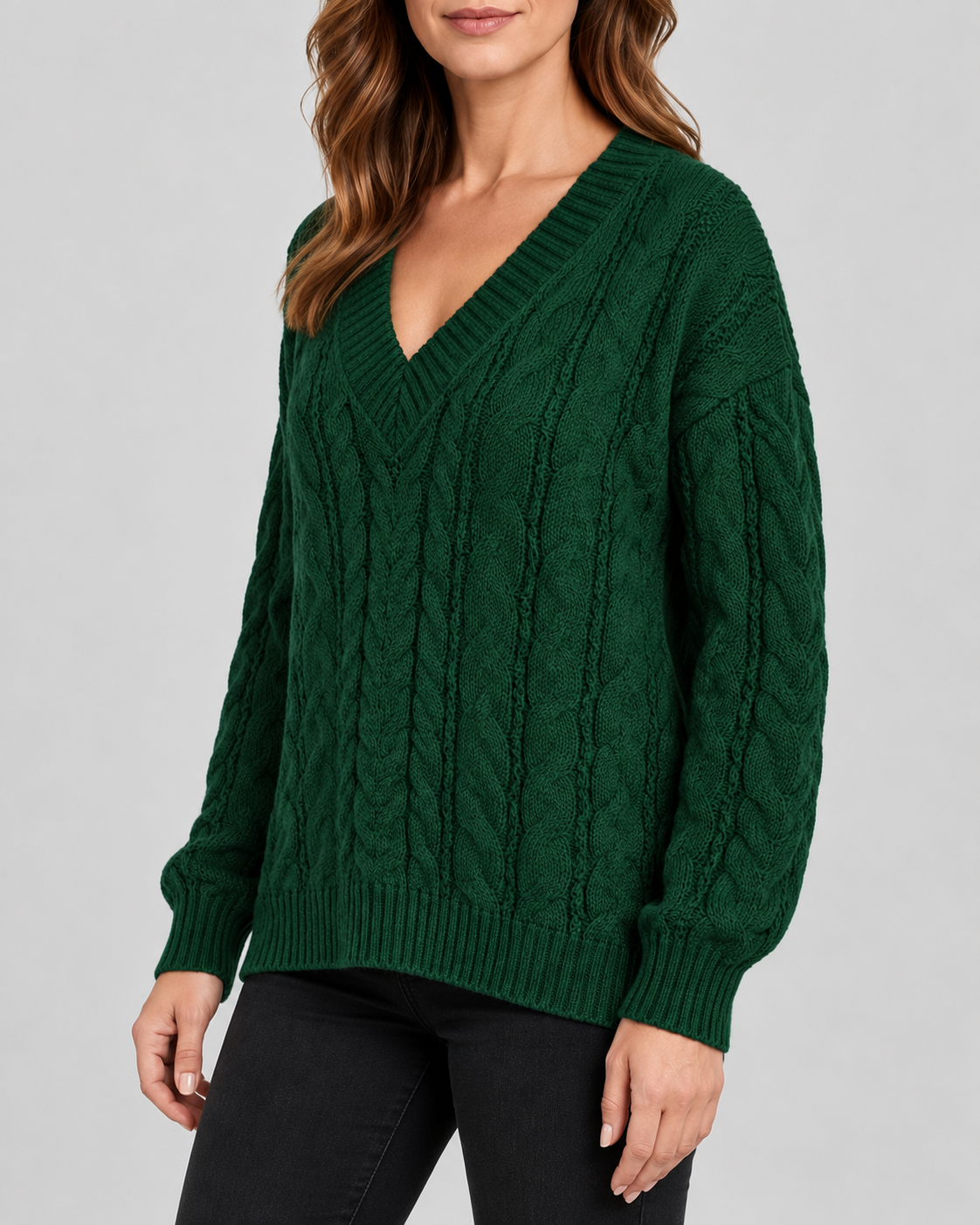 Green cable knit V-neck jumper – three-quarter view