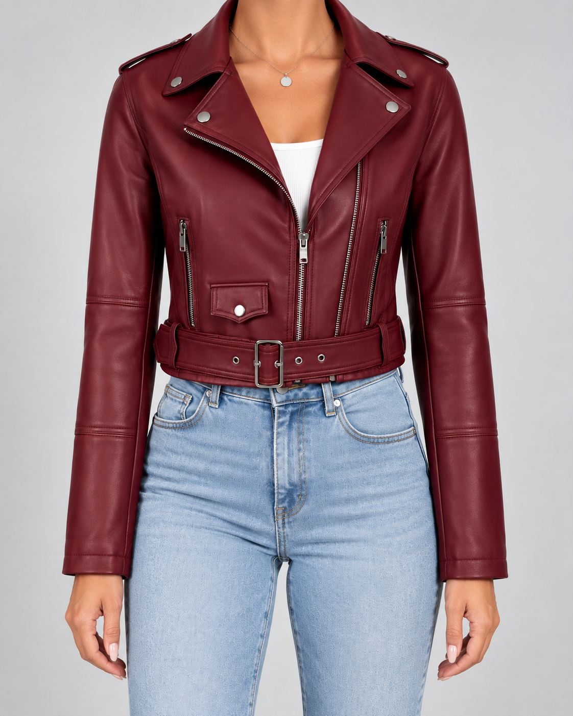 Burgundy cropped faux leather moto jacket styled with jeans