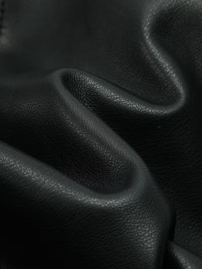 Black cropped faux leather moto jacket texture