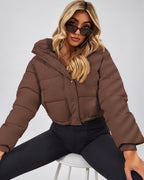 Women's Cropped Hooded Puffer Jacket with Zip Front and Drawcord Hem in Dark Brown – studio view