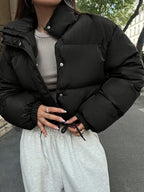 Women's Cropped Quilted Puffer Jacket with Stand Collar and Press Stud Placket in Black – Front View