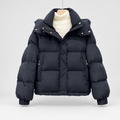 Women's High Neck Puffer Jacket with Hood and Zip Pockets in Black – Flat Front View