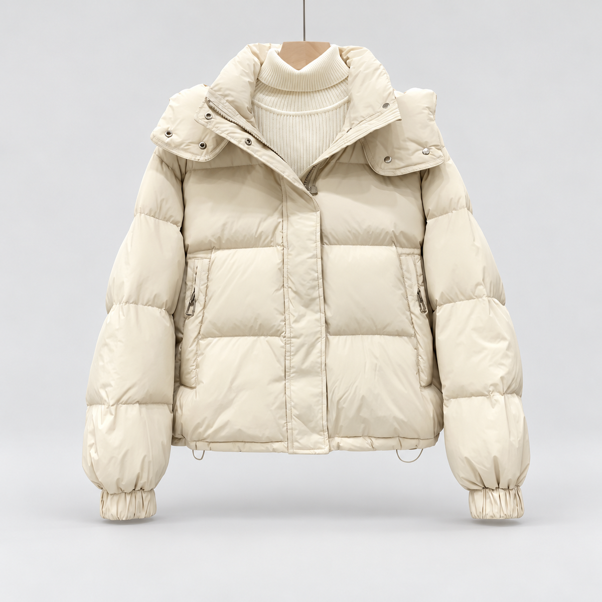 Women's High Neck Puffer Jacket with Hood and Zip Pockets in White – Flat Front View