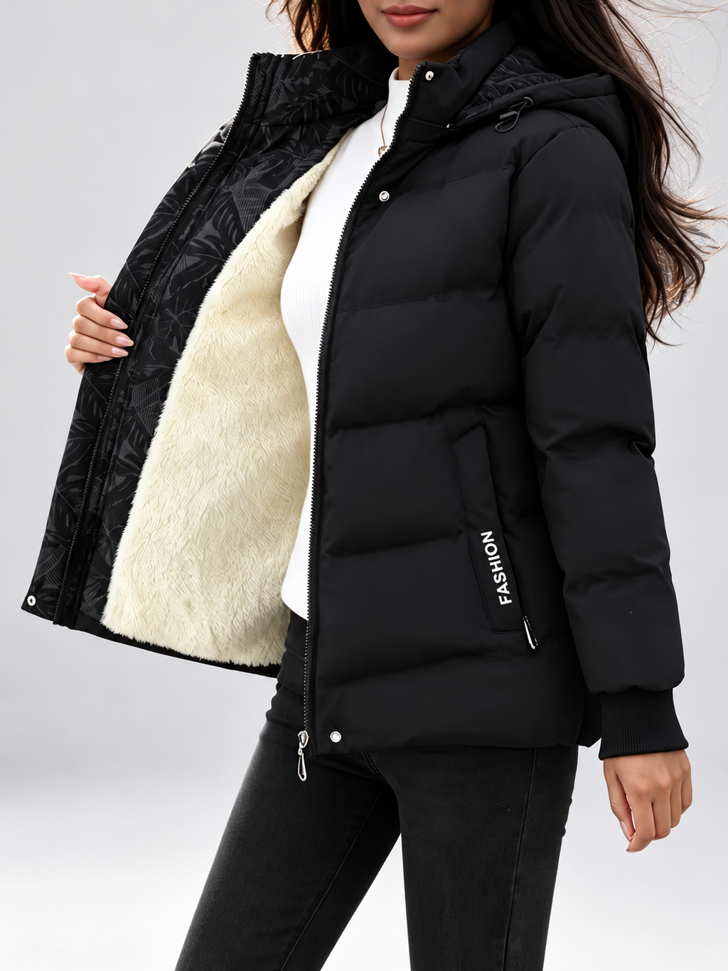 Women's hooded puffer jacket in Black – studio view 13