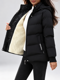 Women's hooded puffer jacket in Black – studio view 13