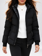 Women's hooded puffer jacket in Black – studio view 14