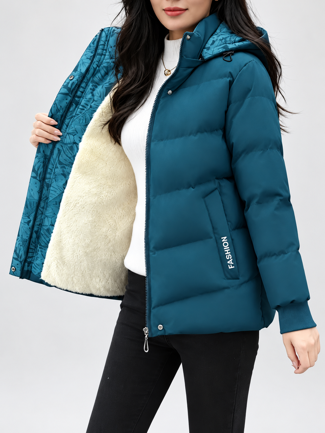Women's hooded puffer jacket in Blue – studio view 6