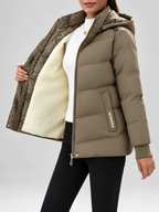 Women's hooded puffer jacket in Khaki – studio view 1